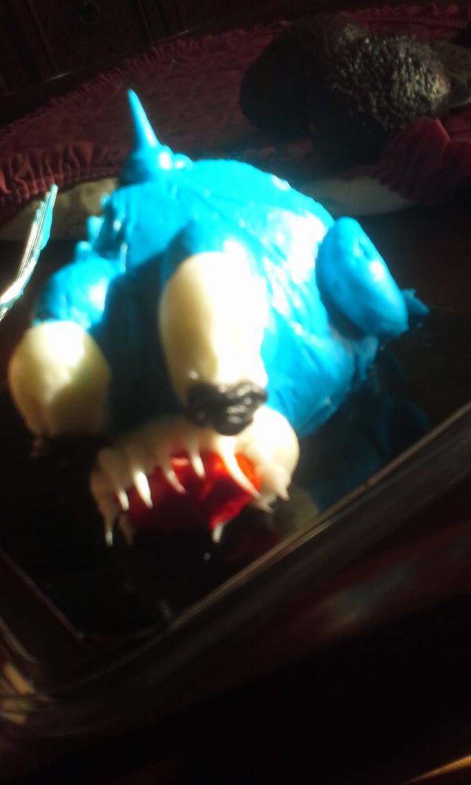 Blue single serve fishcake with too much icing.